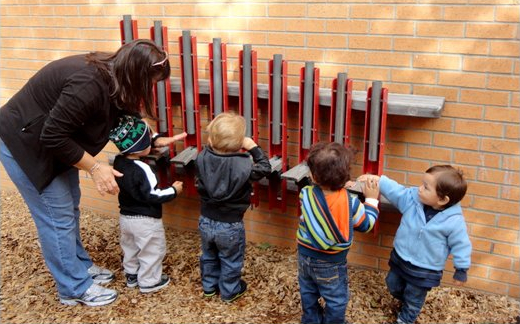 Children exploring instrument